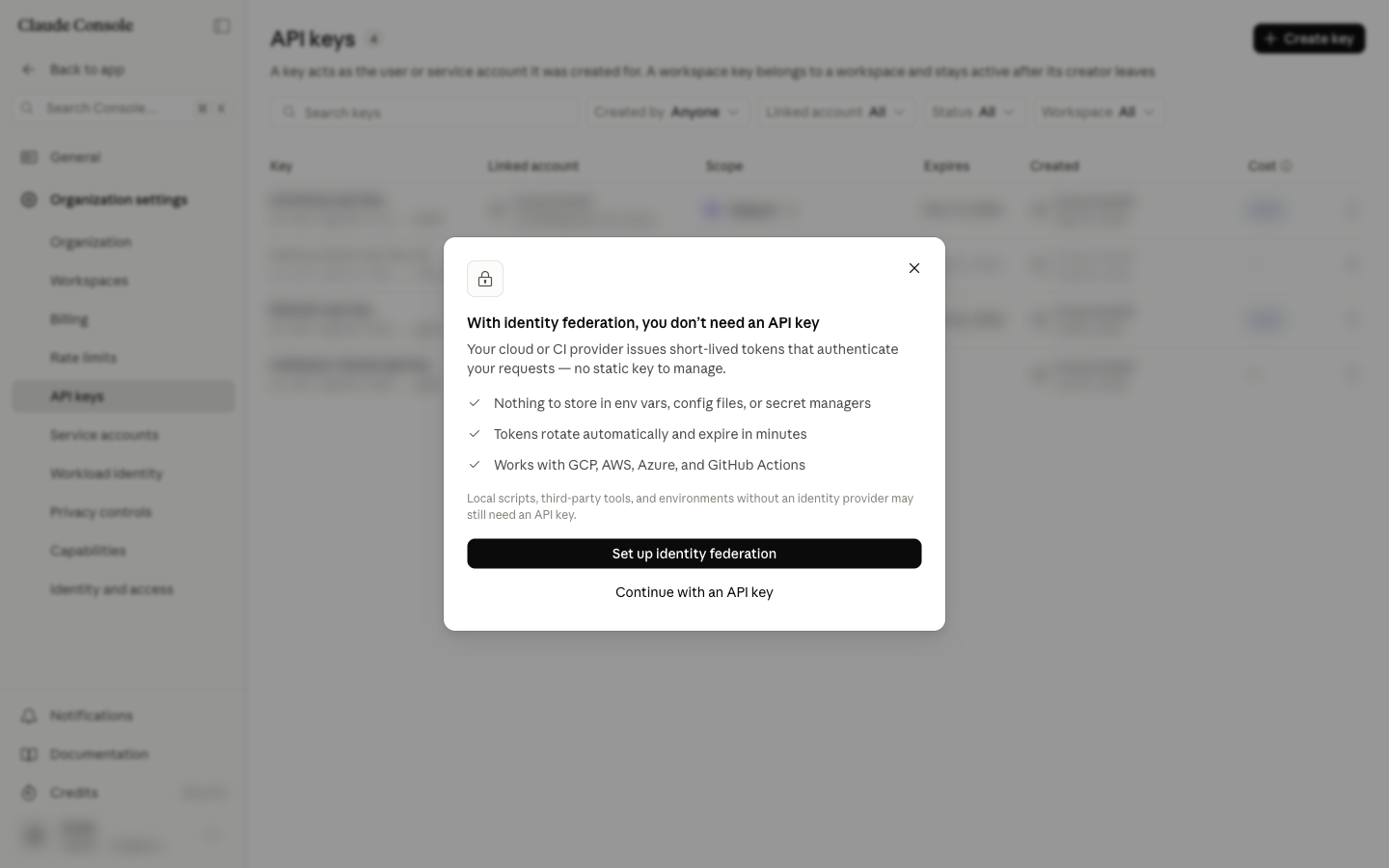 A dialog describing identity federation, with a secondary option labelled Continue with an API key.